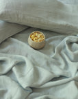 The Handwoven Linen Bedspread, a soft and airy layer that brings effortless elegance to the bedroom. Crafted from handwoven linen, its texture adds warmth and character, blending seamlessly with a relaxed, modern aesthetic.