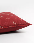 Cushion Cover – A charming cotton cushion cover in a deep red hue, delicately block-printed with floral motifs. The soft, breathable cotton fabric and traditional hand-block printing technique bring warmth and character, making it a perfect accent piece for cozy, timeless interiors