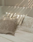 The Solara Linen Bedspread, a handwoven masterpiece that blends natural elegance with intricate embroidery. Its soft linen texture and delicate floral patterns add warmth and serenity to any bedroom, catching the morning light beautifully.