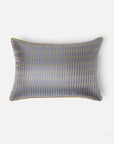 Mehira Silk Cushion Cover – A striking silk cushion cover woven with intricate geometric patterns in deep blue, gold, and maroon hues. The shimmering silk fabric catches the light, revealing a rich interplay of textures and tones. Expertly handcrafted, this cushion cover embodies the finesse of traditional weaving, adding an elegant and sophisticated touch to any space.
