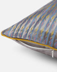 Mehira Silk Cushion Cover – A striking silk cushion cover woven with intricate geometric patterns in deep blue, gold, and maroon hues. The shimmering silk fabric catches the light, revealing a rich interplay of textures and tones. Expertly handcrafted, this cushion cover embodies the finesse of traditional weaving, adding an elegant and sophisticated touch to any space.