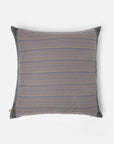 Sofia Cushion Cover – A beautifully handwoven cotton cushion cover featuring a subtle ikat-inspired pattern in warm, earthy tones of yellow, grey, and burgundy. Finished with delicate hand-stitched detailing and a contrasting dark-hued border, this piece embodies craftsmanship and understated elegance. Perfect for adding texture and character to any living space.