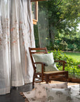 Elegantly Draped Curtains – A delicate, handcrafted curtain made from fine, textured fabric, adorned with intricate hand embroidery and soft pink floral appliqués. Each flower is carefully stitched with subtle detailing, creating a graceful and refined design. The flowing branches and leaves add a natural, organic touch, making these curtains a timeless addition to any elegant home setting.