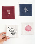 Handcrafted Cotton Coasters – A set of handwoven cotton coasters, featuring hand block-printed floral and abstract designs. Each piece is carefully crafted, bringing a refined yet natural touch to your table setting. Perfect for adding warmth and artistry to your daily moments.