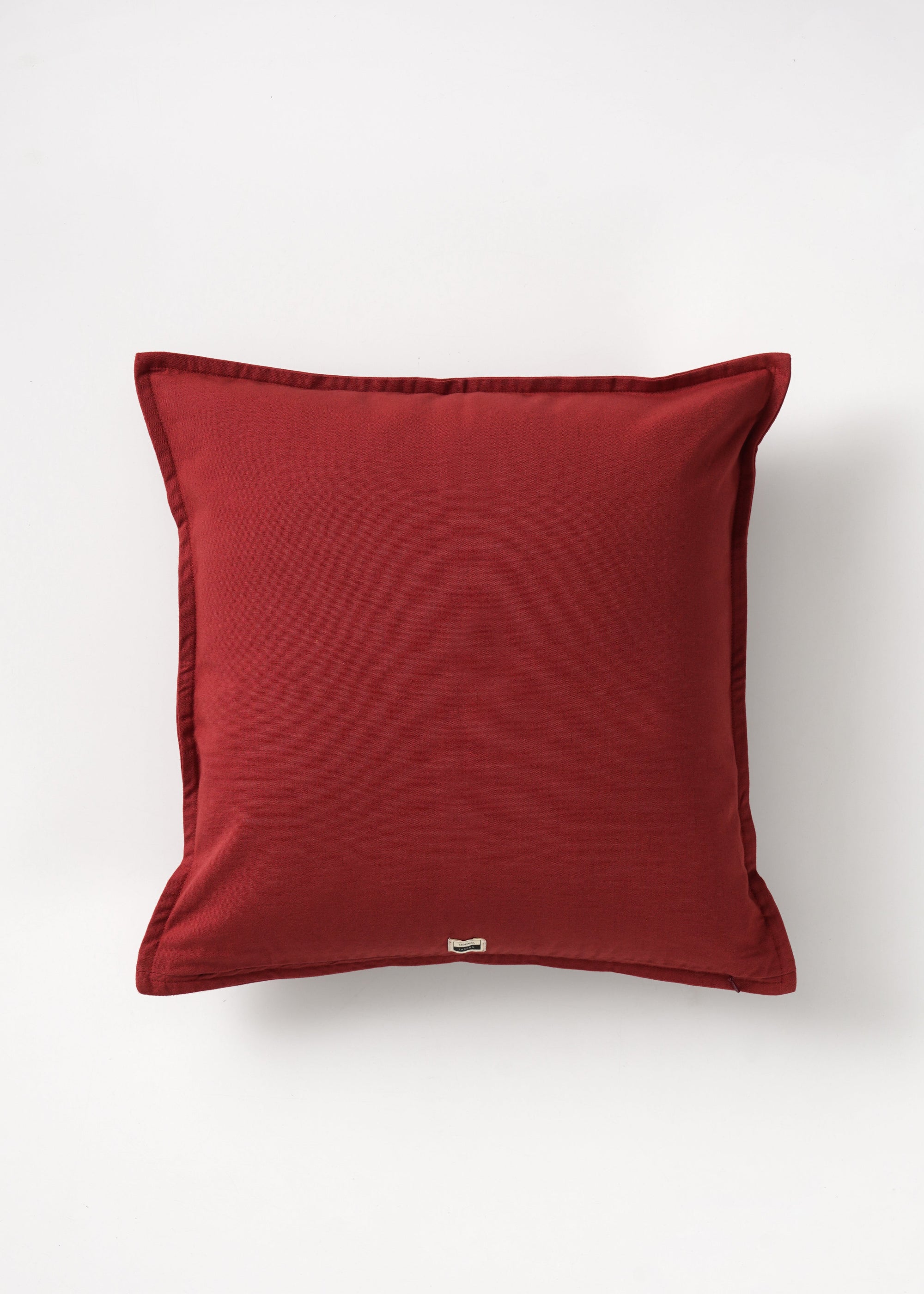  Cushion Cover – A charming cotton cushion cover in a deep red hue, delicately block-printed with floral motifs. The soft, breathable cotton fabric and traditional hand-block printing technique bring warmth and character, making it a perfect accent piece for cozy, timeless interiors