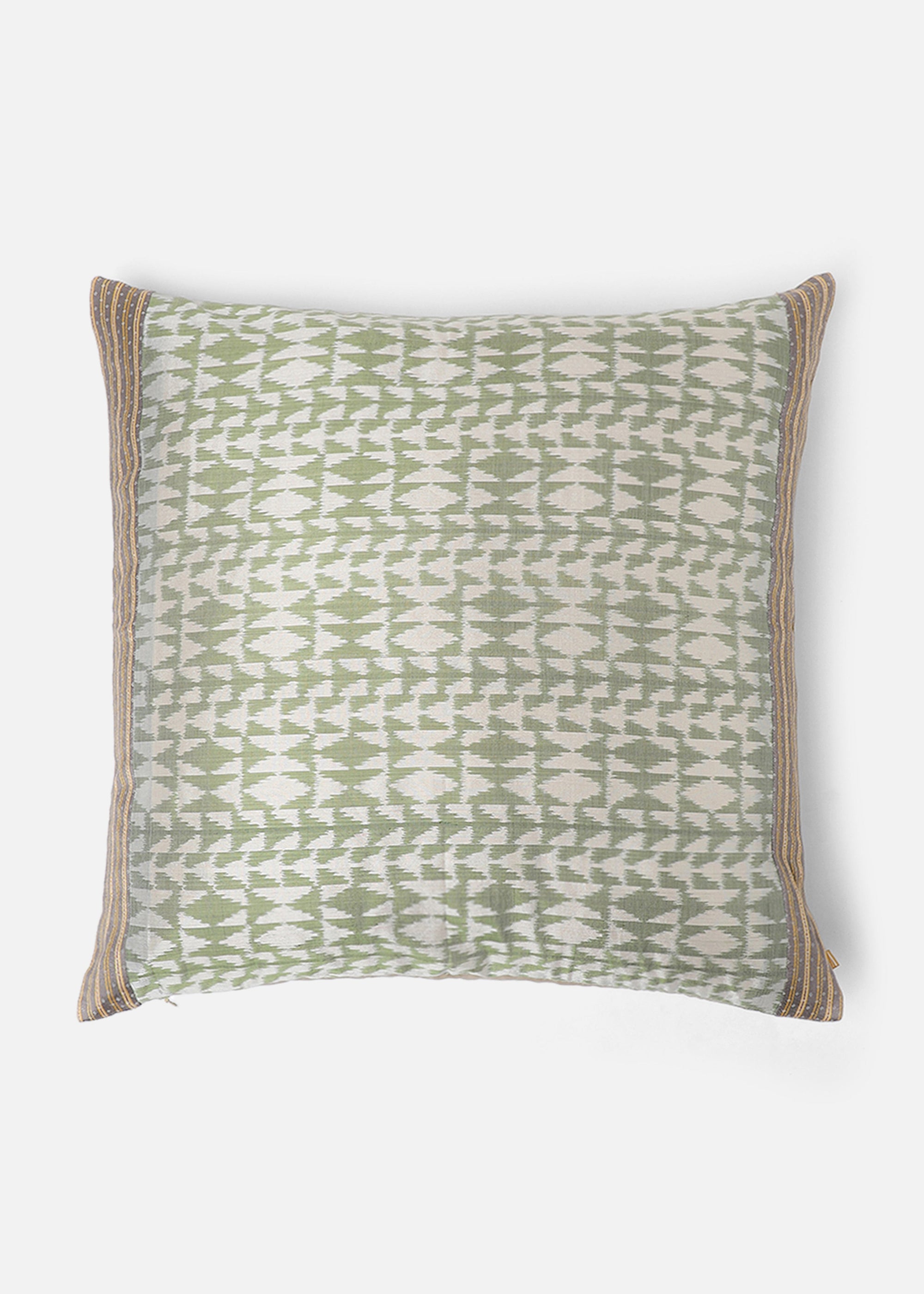 Vivia Cushion Cover – A refined blend of silk and cotton, this cushion cover showcases an intricate ikat-inspired pattern in soft sage green and ivory. Handwoven with exceptional craftsmanship, its delicate striped borders add a touch of elegance. A versatile piece that enhances both contemporary and traditional spaces.