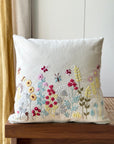 Flourish Embroidery Cushion Cover – A beautifully handwoven cotton cushion cover featuring intricate hand embroidery. Every floral detail is meticulously stitched, bringing texture and artistry to life. A true celebration of craftsmanship, adding warmth and elegance to any space.