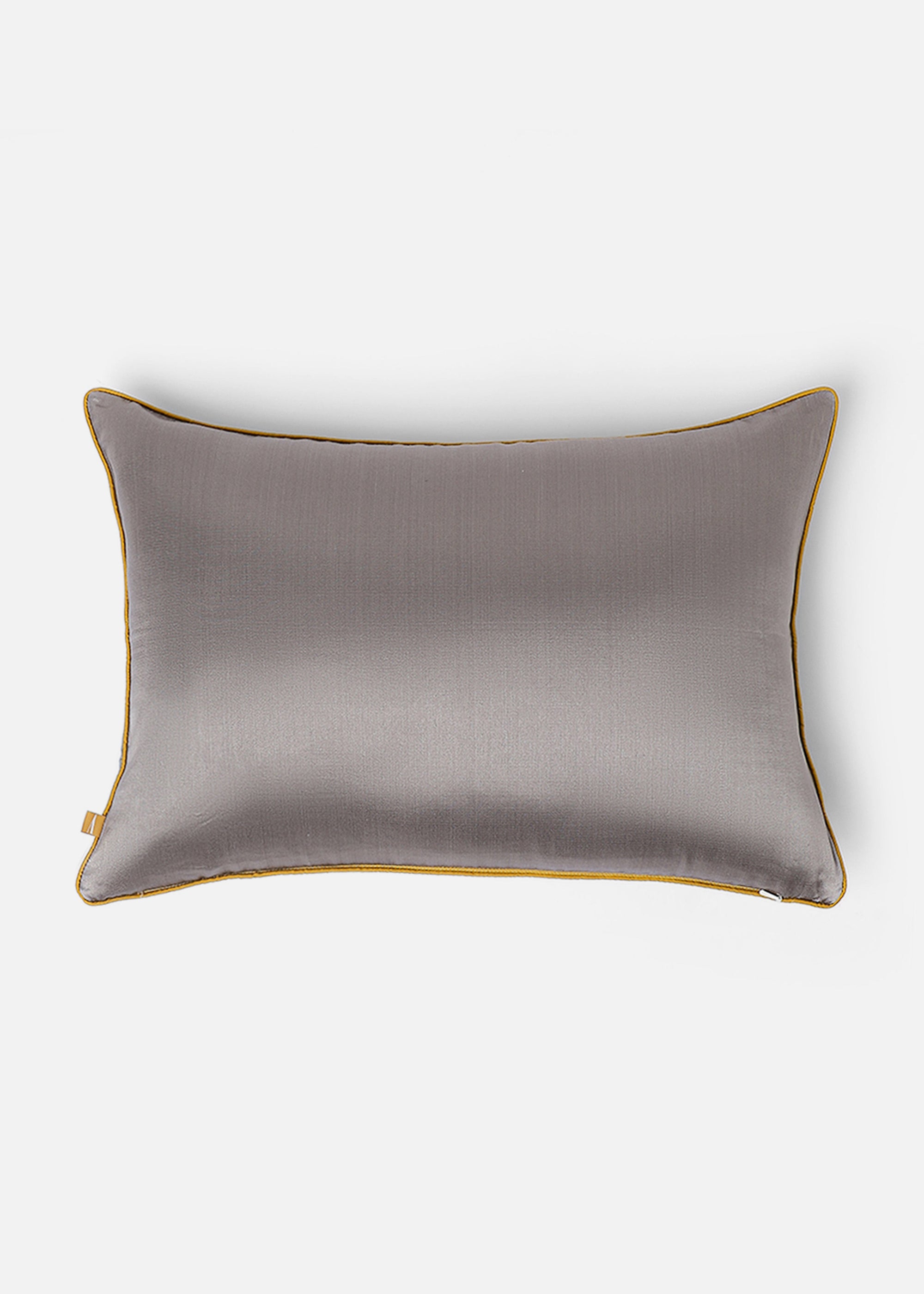 Mehira Silk Cushion Cover – A striking silk cushion cover woven with intricate geometric patterns in deep blue, gold, and maroon hues. The shimmering silk fabric catches the light, revealing a rich interplay of textures and tones. Expertly handcrafted, this cushion cover embodies the finesse of traditional weaving, adding an elegant and sophisticated touch to any space.
