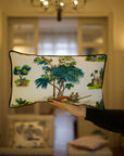 A handcrafted cushion resting, featuring the Mughal Orchard Cushion Cover from Idli by Thierry Journo. A fusion of heritage craftsmanship and contemporary design, each piece tells a unique story.