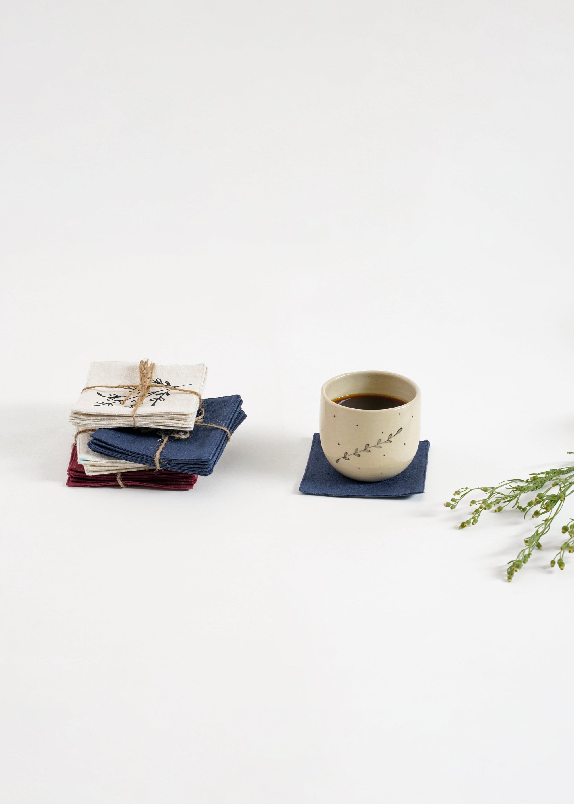 Handcrafted Cotton Coasters – A set of handwoven cotton coasters, featuring hand block-printed floral and abstract designs. Each piece is carefully crafted, bringing a refined yet natural touch to your table setting. Perfect for adding warmth and artistry to your daily moments.